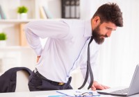 Why is lower back pain considered one of the hardest conditions to address?   
